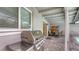 Covered patio with grill and outdoor dining area overlooking the pool at 755 Taplow Rd, Venice, FL 34293
