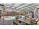 Relaxing screened-in pool with dining area, perfect for outdoor entertaining at 755 Taplow Rd, Venice, FL 34293