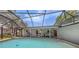 Screened pool area featuring a spacious pool, brick pavers, patio, and outdoor dining at 755 Taplow Rd, Venice, FL 34293