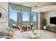 Balcony with outdoor seating and stunning city views from this modern living room space at 777 N Ashley Dr # 1712, Tampa, FL 33602