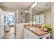 Bathroom featuring granite counters, white cabinets and a glass enclosed shower at 777 N Ashley Dr # 1712, Tampa, FL 33602