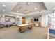 Spacious game room featuring a pool table, comfortable seating, and a flat-screen TV for entertainment at 777 N Ashley Dr # 1712, Tampa, FL 33602