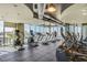 Well-equipped gym with treadmills, ellipticals, and city views through expansive windows at 777 N Ashley Dr # 1712, Tampa, FL 33602