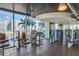Modern gym with strength training equipment and stunning views of palm trees and city skyline at 777 N Ashley Dr # 1712, Tampa, FL 33602