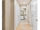 Bright hallway with wood floors leads to a full bathroom, and has convenient closet space at 777 N Ashley Dr # 1712, Tampa, FL 33602