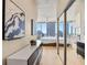 Bright hallway with hardwood floors, built-in shelves, and bedroom access at 777 N Ashley Dr # 1712, Tampa, FL 33602