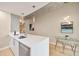Contemporary kitchen with a breakfast bar, stainless steel dishwasher, and modern pendant lighting at 777 N Ashley Dr # 1712, Tampa, FL 33602