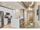 Modern condo kitchen featuring stainless steel appliances, a center island, and sleek cabinetry at 777 N Ashley Dr # 1712, Tampa, FL 33602