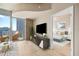 Living room with a balcony offering beautiful city views, and an open door to the bedroom at 777 N Ashley Dr # 1712, Tampa, FL 33602