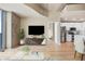 Bright living room with a TV, leading to the kitchen and a bedroom for flexible living at 777 N Ashley Dr # 1712, Tampa, FL 33602