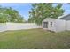 The backyard features a versatile shed, offering potential for a gym or home office, with a privacy fence at 867 Bacon Ave, Sarasota, FL 34232