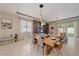Elegant dining room with modern lighting, fireplace, and wood accent wall, offering a cozy and stylish gathering space at 867 Bacon Ave, Sarasota, FL 34232
