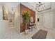Inviting foyer with stylish decor, modern lighting, and a wood-accent wall creating a warm and welcoming entrance at 867 Bacon Ave, Sarasota, FL 34232