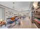 Spacious living room with decor shelving, couch, and open to the kitchen and dining area at 867 Bacon Ave, Sarasota, FL 34232