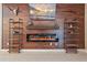 Beautiful living room boasts a modern fireplace and shelving alongside rustic decor at 867 Bacon Ave, Sarasota, FL 34232