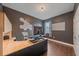 Modern office with dark walls, wood floors, standing desk, and sound-dampening hexagon wall decor at 867 Bacon Ave, Sarasota, FL 34232