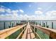 Community boat dock with boat slips and picturesque waterfront views at 8701 Midnight Pass Rd # 206A, Sarasota, FL 34242