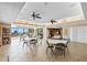 Spacious clubhouse interior with tables, chairs, and a kitchenette at 8701 Midnight Pass Rd # 206A, Sarasota, FL 34242