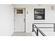 View of the front door to the condominium featuring the unit number and a window at 8701 Midnight Pass Rd # 206A, Sarasota, FL 34242