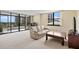 Bright and airy living room with a glass enclosed balcony and comfortable seating at 8701 Midnight Pass Rd # 206A, Sarasota, FL 34242