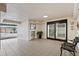 Entry way with elevator, tile flooring, seating and view of the garage area at 8701 Midnight Pass Rd # 206A, Sarasota, FL 34242