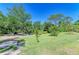 Expansive backyard featuring mature trees and ample space for recreation at 906 134Th E St, Bradenton, FL 34212