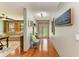 Inviting entryway with hardwood floors, bench seating, and decor at 906 134Th E St, Bradenton, FL 34212