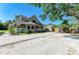 Charming home featuring a welcoming front porch and a well-manicured lawn and driveway at 906 134Th E St, Bradenton, FL 34212