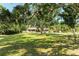Spacious lawn with large shade tree in front of the house at 906 134Th E St, Bradenton, FL 34212