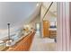Hallway showcasing vaulted ceilings and decorative wall plates, leading to bedroom at 906 134Th E St, Bradenton, FL 34212