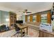 Spacious home office with natural light, built-in bookcase, and comfortable seating at 906 134Th E St, Bradenton, FL 34212