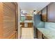 Modern kitchen with stainless steel appliances, granite countertops, and plenty of cabinet space at 906 134Th E St, Bradenton, FL 34212