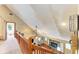 View of the living room with fireplace, from an overhead balcony at 906 134Th E St, Bradenton, FL 34212
