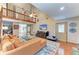 Spacious living room with high ceilings, a comfortable sofa, and plenty of natural light at 906 134Th E St, Bradenton, FL 34212