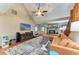 Comfortable living room with a fireplace, media center, vaulted ceiling, and inviting seating area at 906 134Th E St, Bradenton, FL 34212
