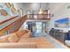 Spacious living room features high ceilings, a staircase, and an open floor plan design at 906 134Th E St, Bradenton, FL 34212