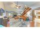 Cozy living room with a stone fireplace, vaulted ceilings, comfortable seating, and rustic decor at 906 134Th E St, Bradenton, FL 34212