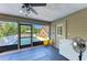 Enclosed porch offering views of the pool and backyard, with extra freezer at 906 134Th E St, Bradenton, FL 34212