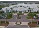 Stunning aerial view of the Driftwood Club, showcasing its beautiful architecture and manicured grounds at 8752 Coastal Key Way, Parrish, FL 34219