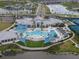 An inviting pool at the Driftwood Club, surrounded by comfortable lounge chairs and shaded seating areas at 8752 Coastal Key Way, Parrish, FL 34219