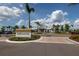 Welcome to the Driftwood Club, a picturesque community center with lush landscaping and palm trees at 8752 Coastal Key Way, Parrish, FL 34219