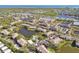 An aerial view of a beautiful condo community featuring lakes, pools, and manicured landscaping at 10265 Gandy N Blvd # 1004, St Petersburg, FL 33702