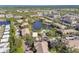 Aerial view of a community with ponds, pools, and lush landscaping at 10265 Gandy N Blvd # 1004, St Petersburg, FL 33702