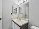 Bathroom with a large mirror, vanity, sink, and decorative cactus sitting on the sink counter at 10265 Gandy N Blvd # 1004, St Petersburg, FL 33702