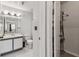 Bathroom featuring a vanity with a sink and a large mirror, next to a closet and the toilet at 10265 Gandy N Blvd # 1004, St Petersburg, FL 33702