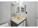 Bathroom featuring a vanity with a mirror, lighting fixtures and a toilet at 10265 Gandy N Blvd # 1004, St Petersburg, FL 33702