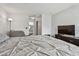 Cozy bedroom featuring a comfortable bed, television, and an ensuite bathroom at 10265 Gandy N Blvd # 1004, St Petersburg, FL 33702