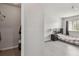 Bedroom featuring a walk-in closet, wood floors, window, and a bed with a nightstand at 10265 Gandy N Blvd # 1004, St Petersburg, FL 33702