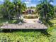 Clubhouse deck featuring outdoor seating with views of the lily pad covered pond at 10265 Gandy N Blvd # 1004, St Petersburg, FL 33702