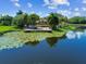 Clubhouse deck with views of a lily pad covered pond at 10265 Gandy N Blvd # 1004, St Petersburg, FL 33702